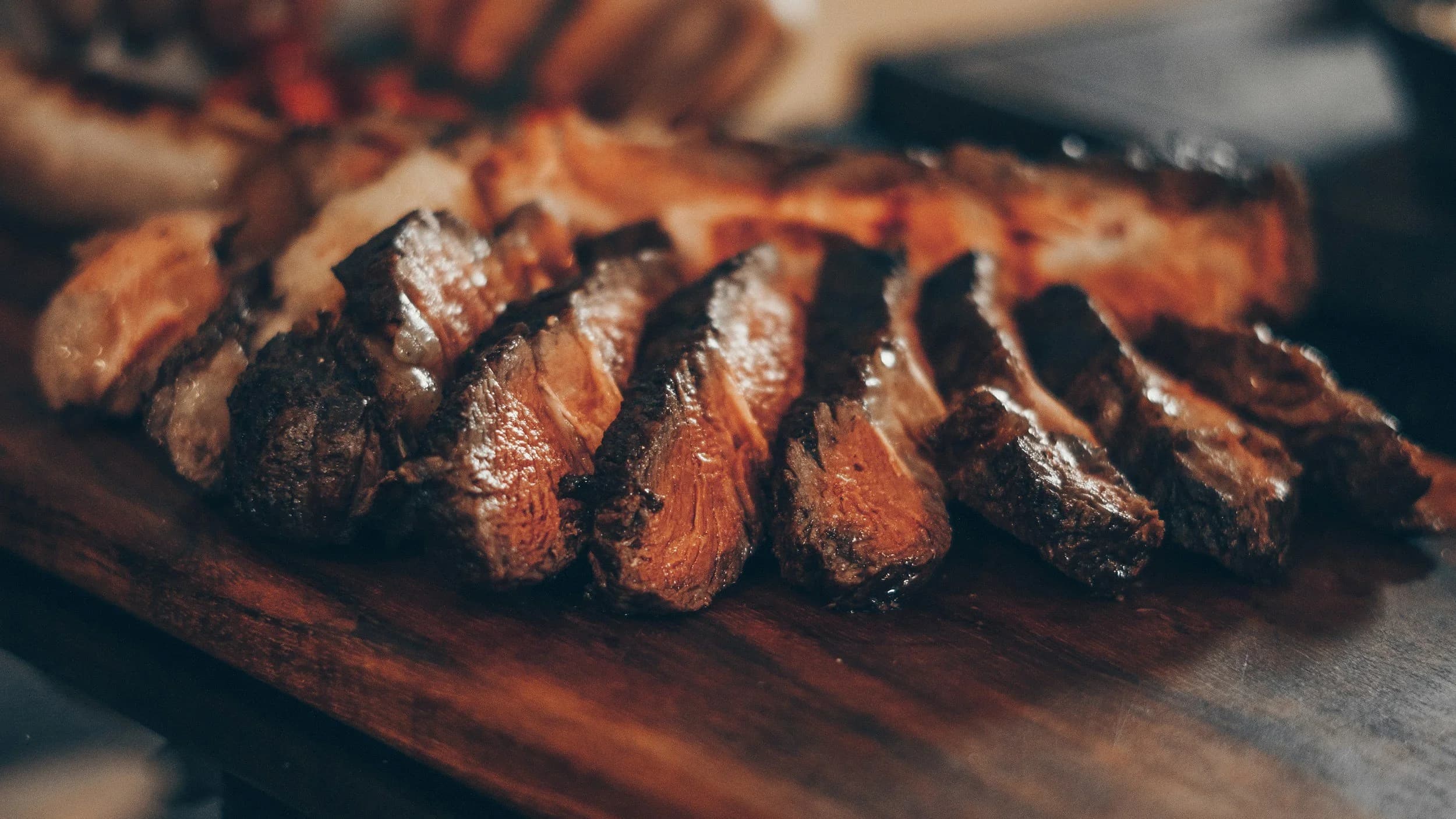 Sliced steak prepared for catered dinner service